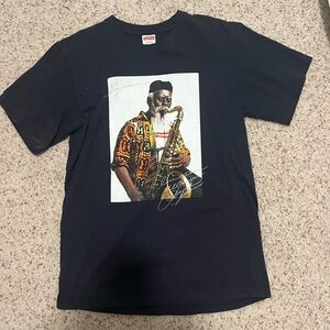 Supreme Black Graphic T-Shirt with Saxophone Print